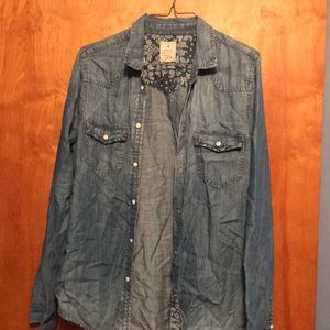 Denim shirt with accents of flower pattern